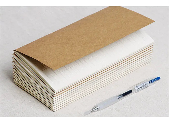 Diary refill inner core showing saddle stitch binding and 11x21cm dimensions