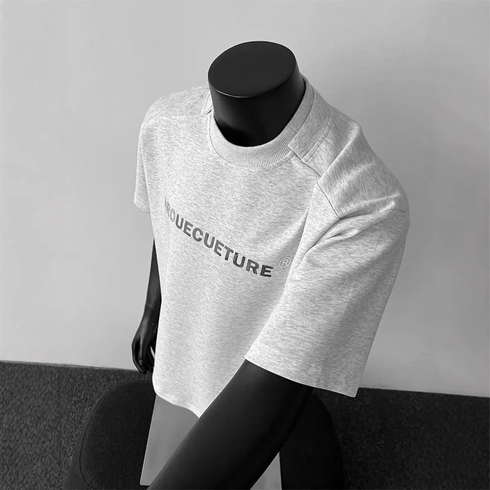 Men's loose short sleeve cotton t-shirt with printed letters in light grey.