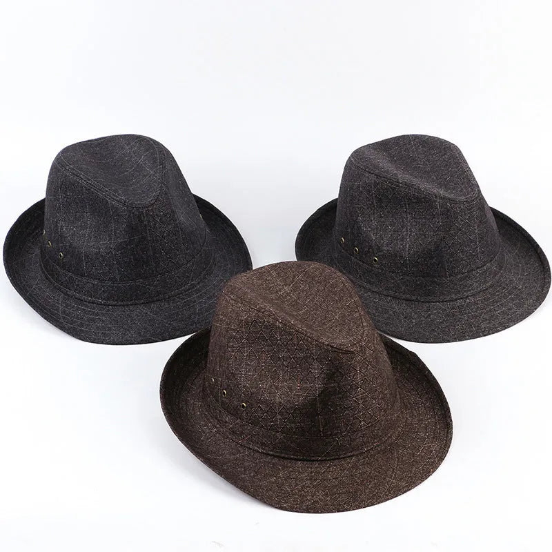 Classic brown fedora hat with structured crown and wide brim on a wooden stand