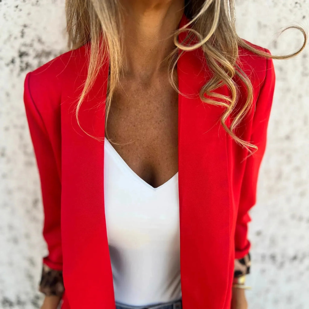 Women's black slim fit blazer with cheetah print pattern on lapels and chest, regular sleeves