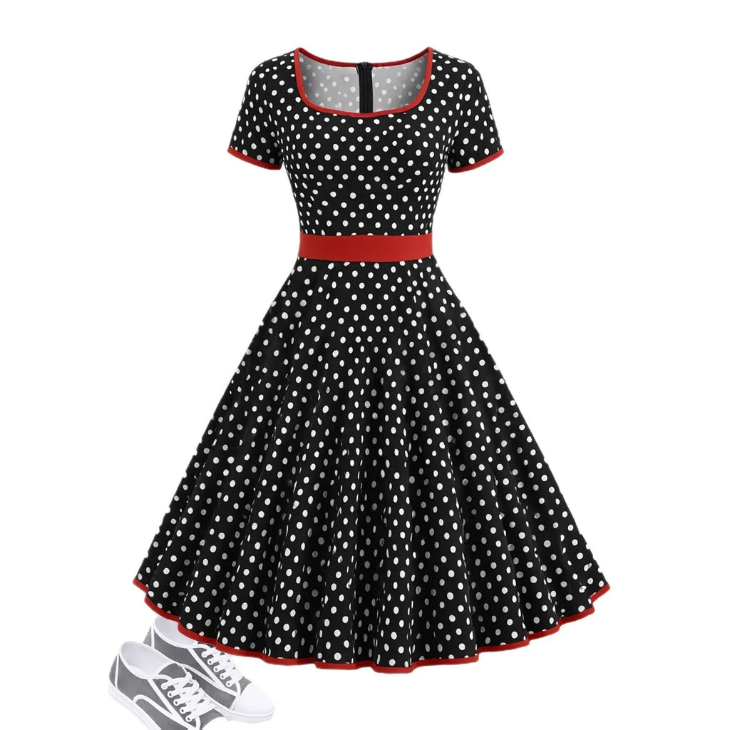 Multicolour polka dot dress with square collar, short sleeves, front zipper, and a pleated mid-length skirt on a hanger.