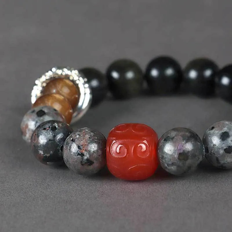 Handcrafted red agate and golden obsidian Wukong bracelet with flame stone pattern