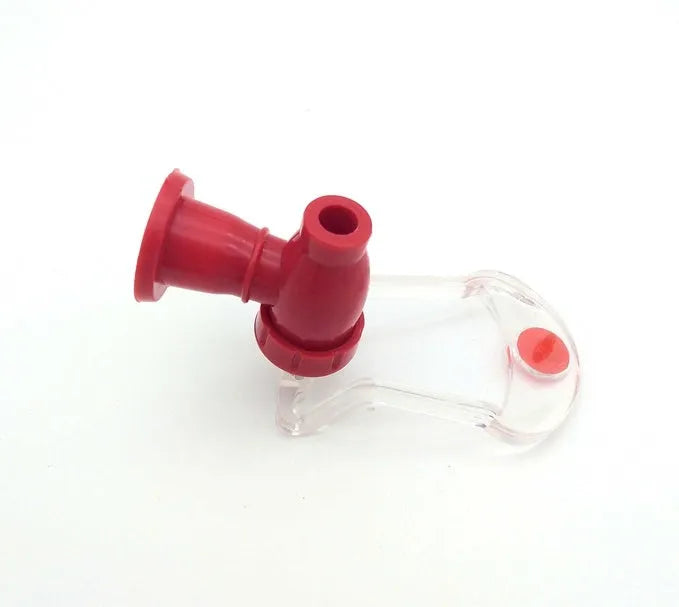 Red plastic Magic Tap soda dispenser attached to an inverted 2-litre bottle