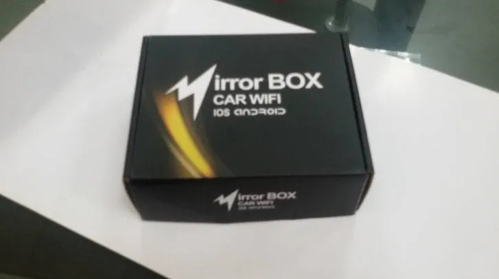 Black car mirror link box with Wi-Fi converter, power cable, antenna, AV cable, and user manual.