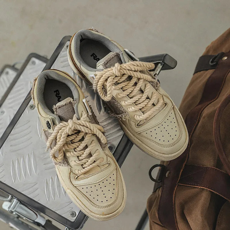 Beige low-top skateboard shoes with microfiber upper and round-toe design