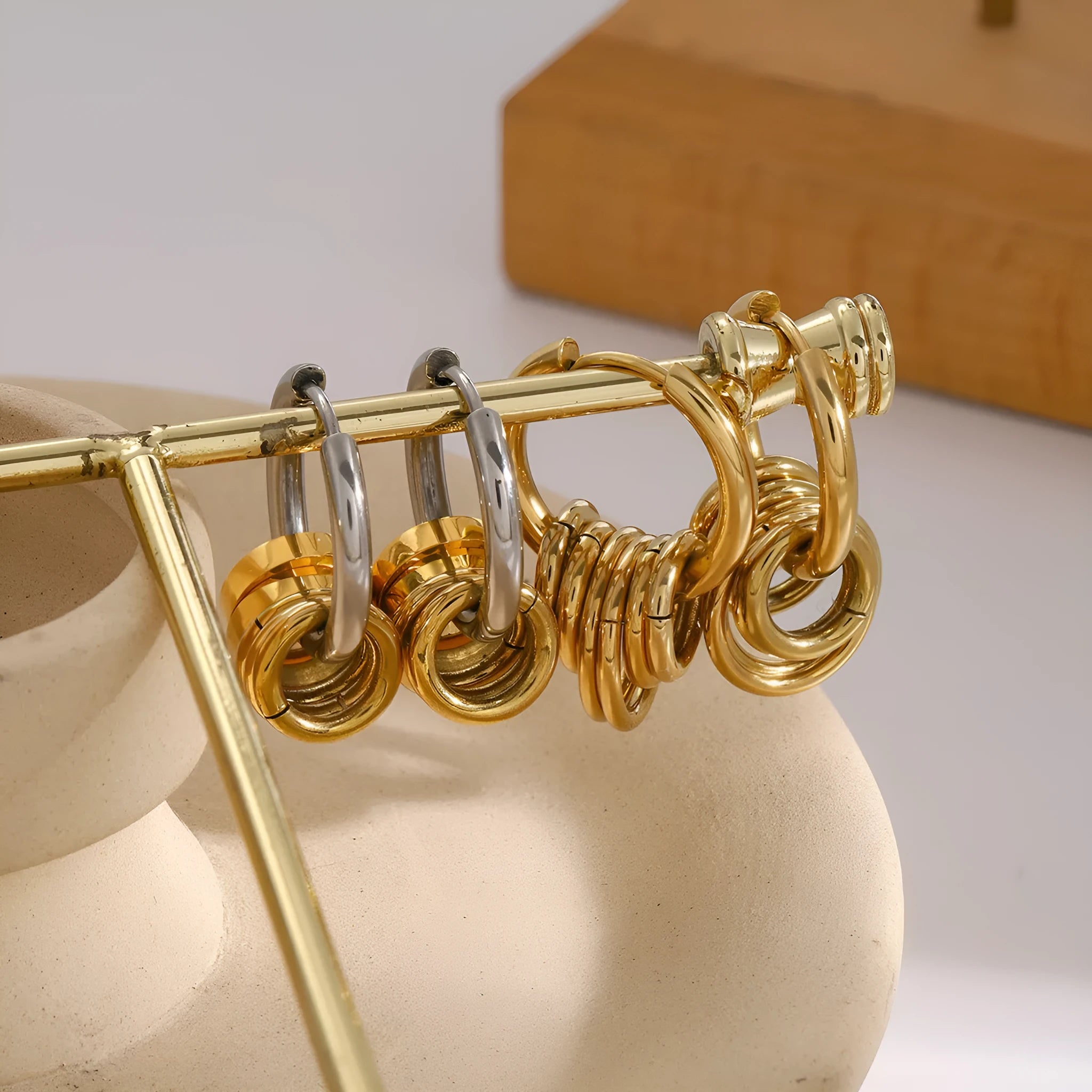 Pair of stainless steel ins style earrings with an electroplated silver-toned finish.
