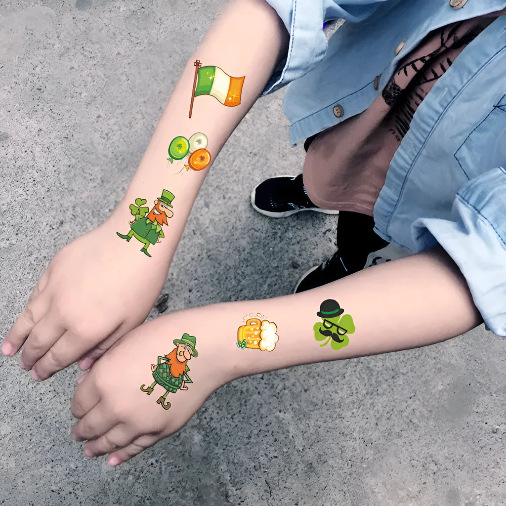 Green clover and Irish flag temporary tattoo sticker on paper backing, showing water transfer design.