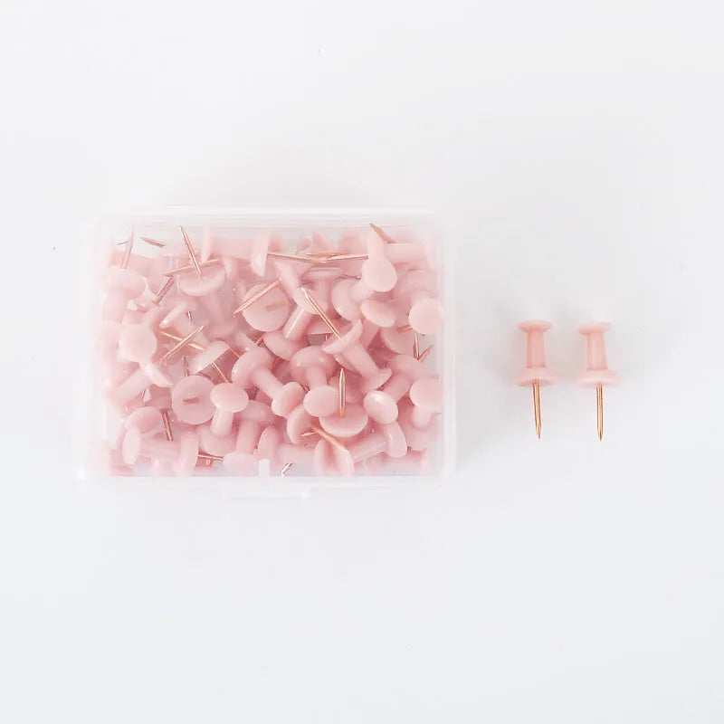 Assortment of Morandi colour push pins including green, grey, and pink tones with different head shapes