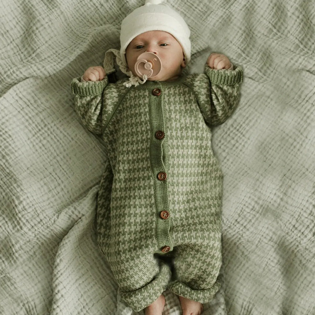 Green autumn knitted cotton sweater for baby with long sleeves and round neck