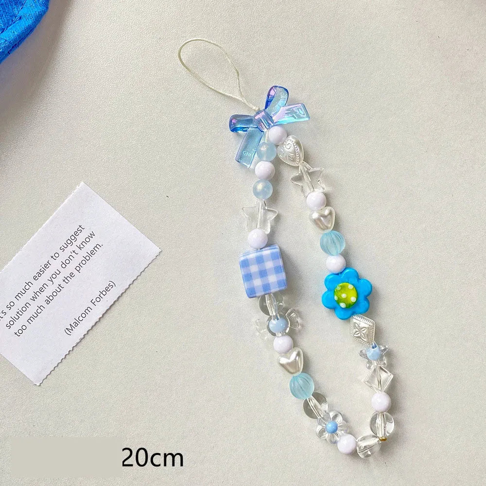 Blue, pink, and yellow floral beaded phone lanyard with plastic resin charms.