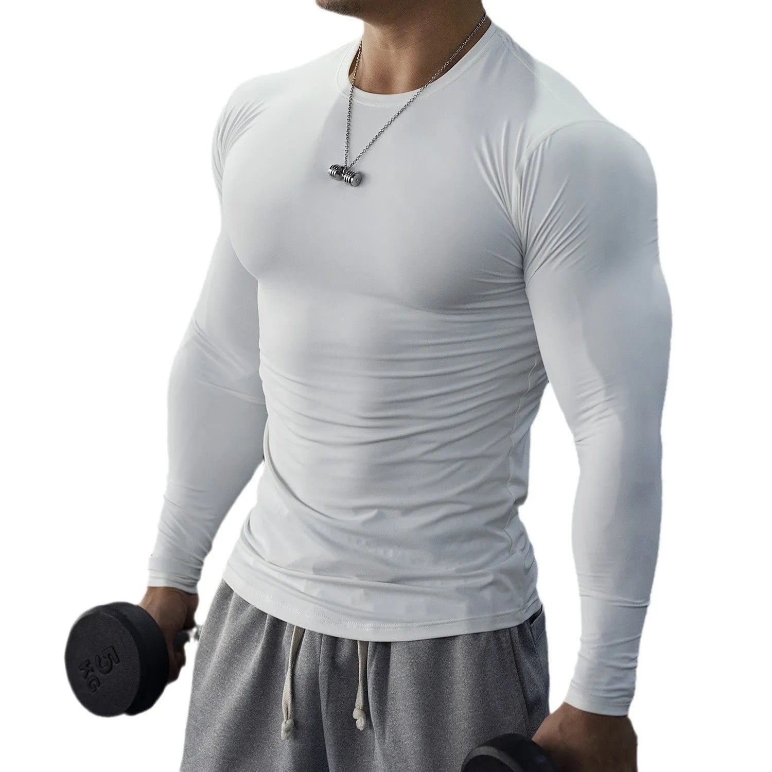 Man wearing black long-sleeved slim-fit fitness tights for running or gym workout