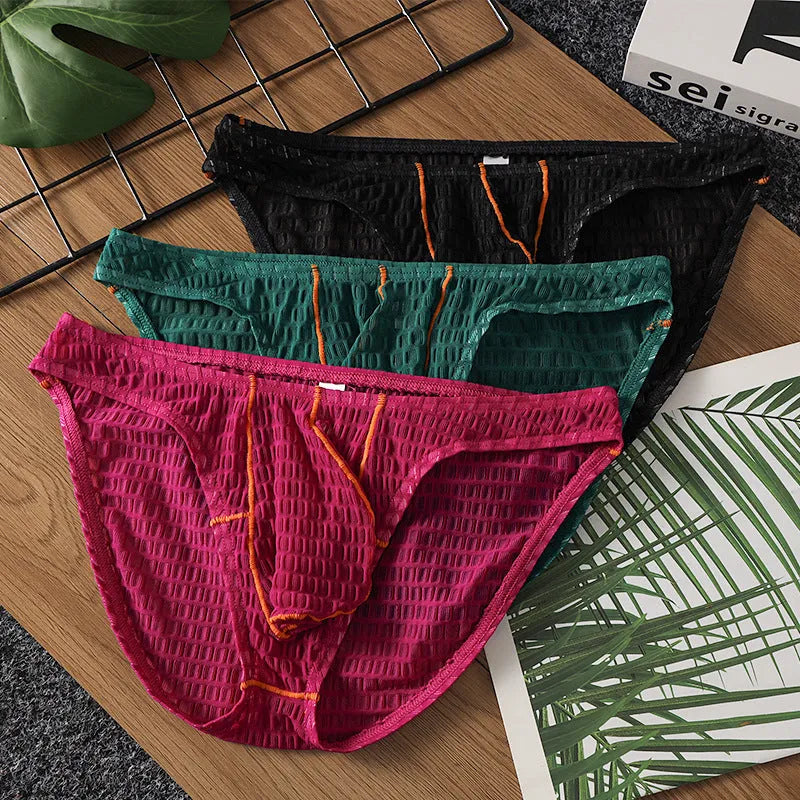 Men's low waist ice silk lace briefs in solid colours including rose red and light purple on a size chart.