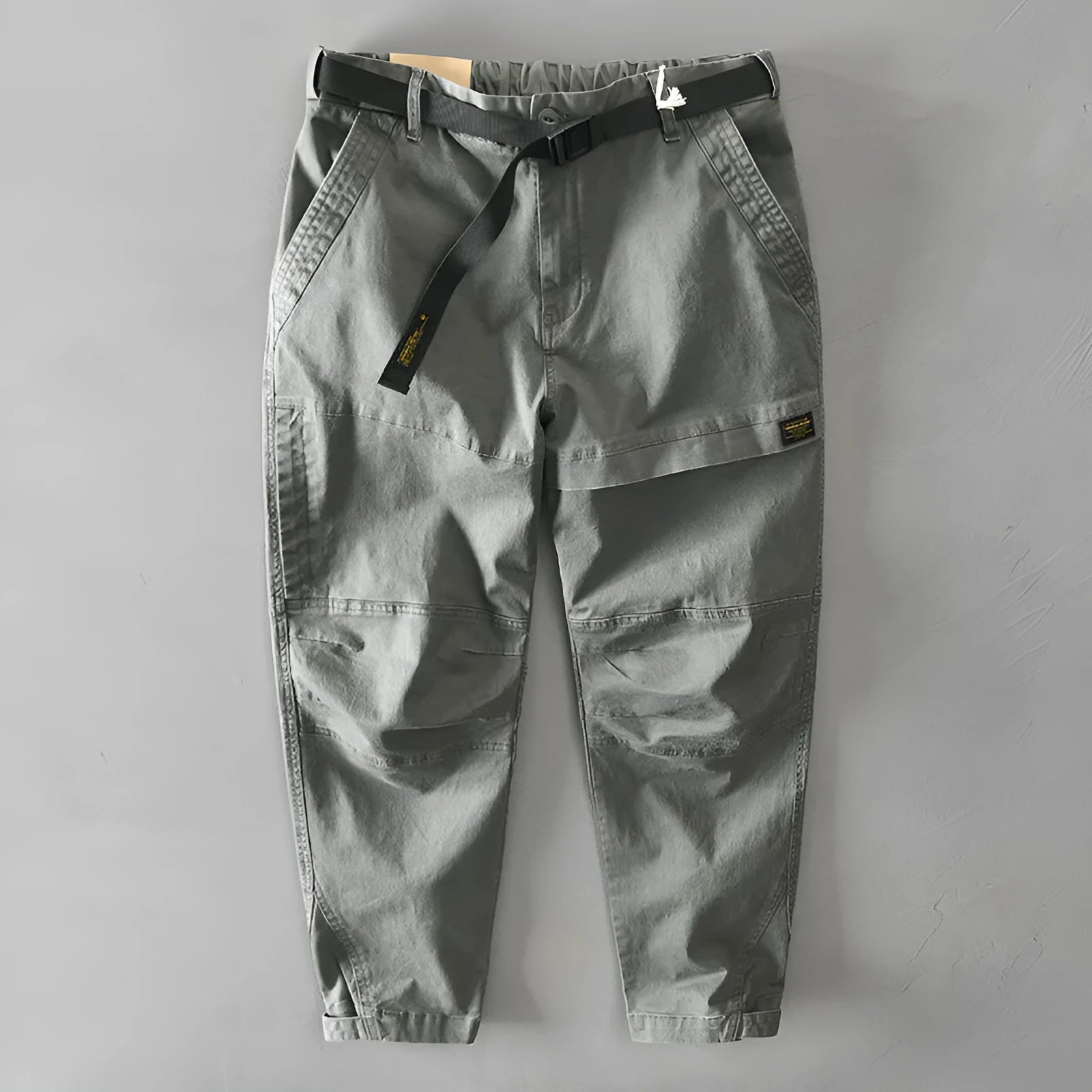 Man wearing khaki cotton elastic casual Japanese overalls with a loose fit.