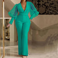 Women's wide leg jumpsuit with mesh stitching detail on long sleeves and elastic waistband