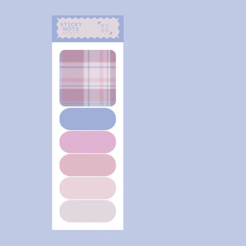 Colourful plaid sticky note memo pad showing eight different designs including blue, pink, and green patterns