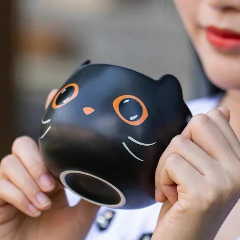 Black cat-shaped ceramic mug with pumpkin decoration and 355ml capacity