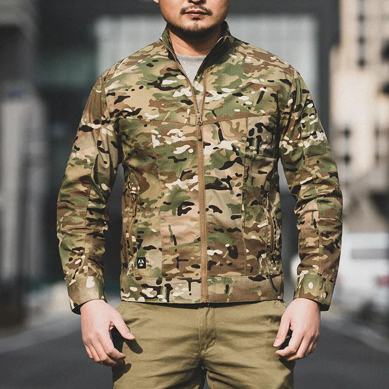 Men's brown plaid tactical camouflage jacket with multiple pockets on a man outdoors.