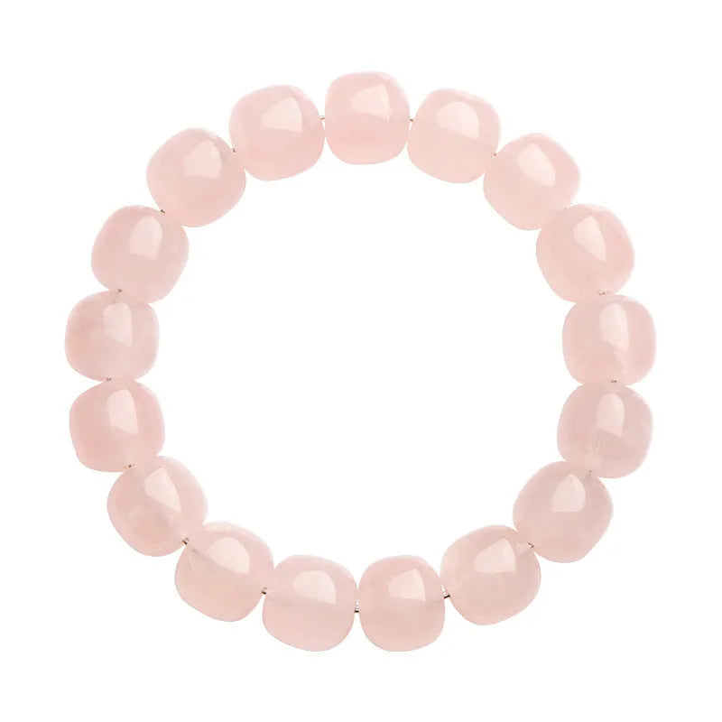 Pink bamboo crystal barrel bead bracelet with 11-12mm beads on a wrist.