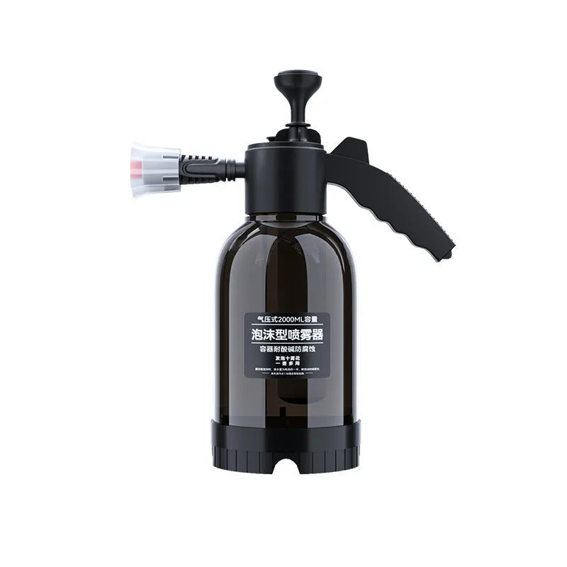 Black hand-held pressure sprayer with 2-litre capacity and two nozzles for garden and car cleaning