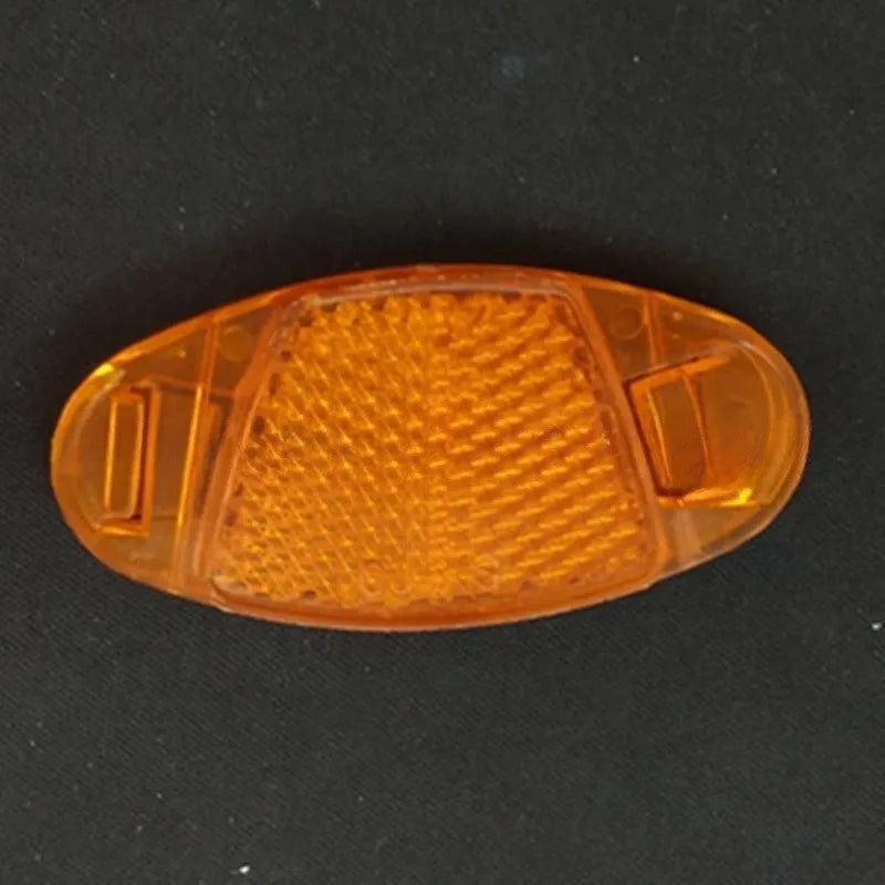 White and yellow plastic bicycle spoke reflectors for wheel safety decoration