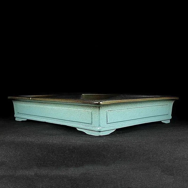 Green handmade ceramic bonsai flower pot with a purple sand crackled glaze finish.