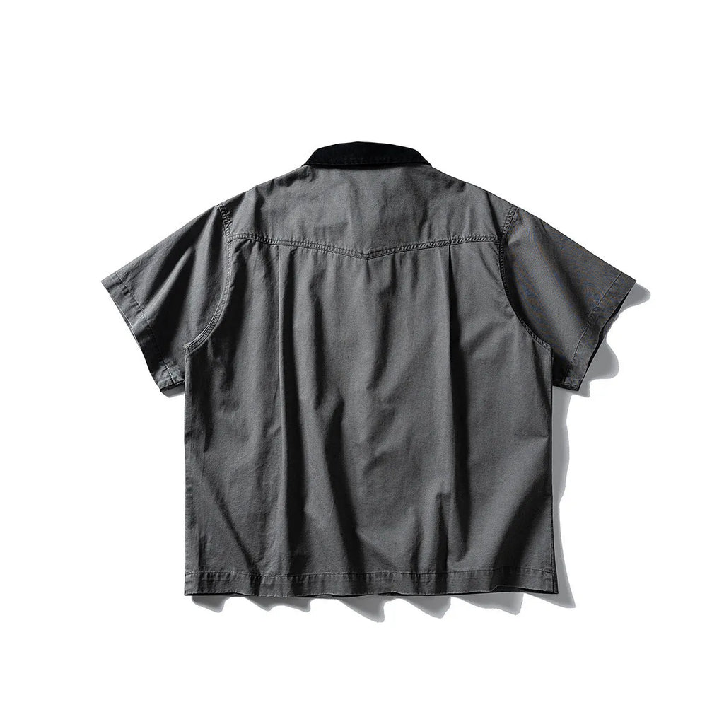 Loose fit grey washed denim short sleeve shirt overalls on a hanger