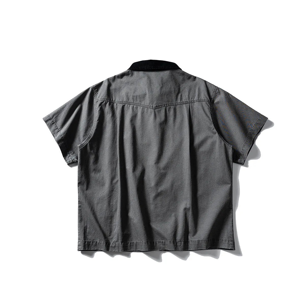 Loose fit grey washed denim short sleeve shirt overalls on a hanger