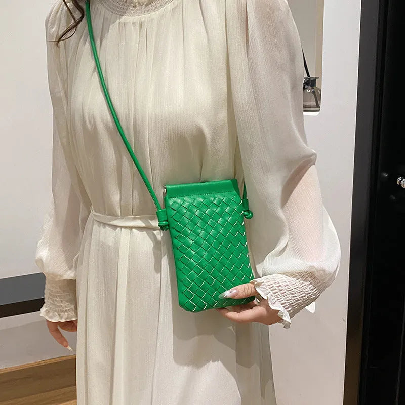 Vintage weave crossbody bag in vertical square shape showing European retro styling and dark cell internal compartment