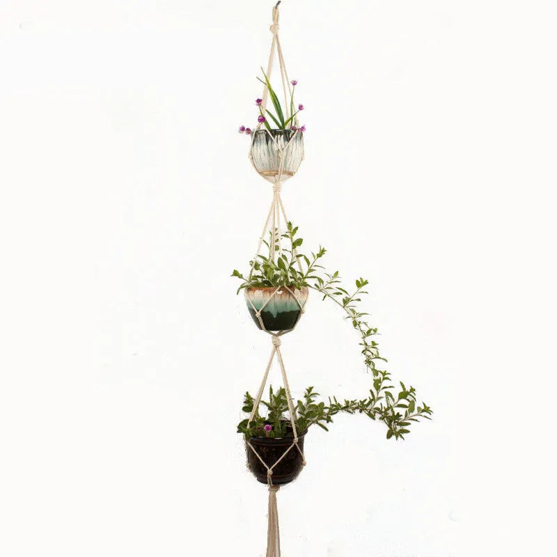 A rustic-style woven cotton rope plant trellis panel supporting green leaves.