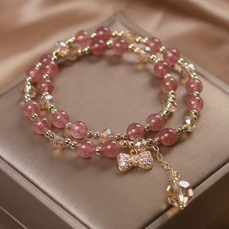 Women's double layer crystal bracelet with lucky cat charm and red cat's eye flowers in ethnic fairy style.