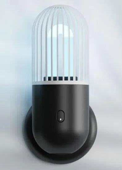 Portable capsule UVC disinfection lamp in four colours with dimensions 64x64x148mm