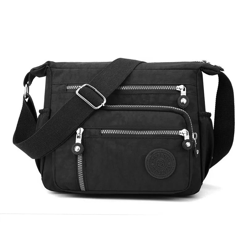 Soft nylon messenger bag in square vertical shape with single shoulder strap