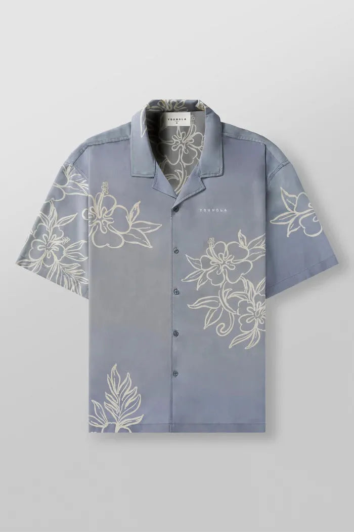 Men's loose-fit short sleeve top with floral print in light colour, laid flat.