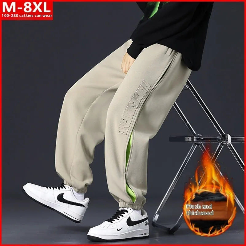Men's loose cotton trousers with stitching detailing and ankle banding in grey green colour