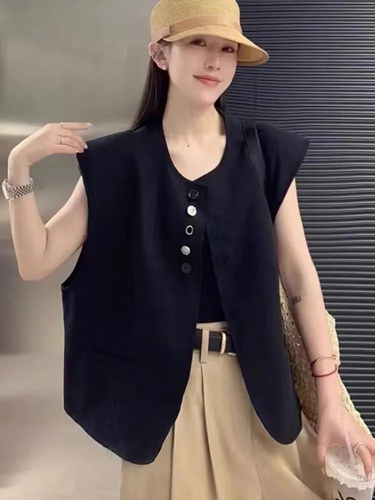 Women's loose fit vest with 40cm short length in milky white colour showing pocket detail