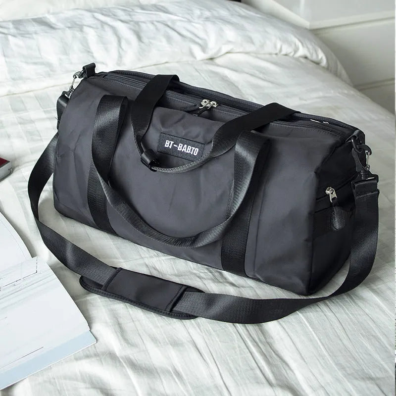 Beige nylon sports bag with contrast colour details and letters pattern