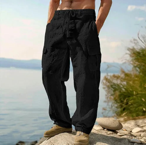 Men's loose cotton wide-leg casual trousers in solid colours showing mid-waist and relaxed fit