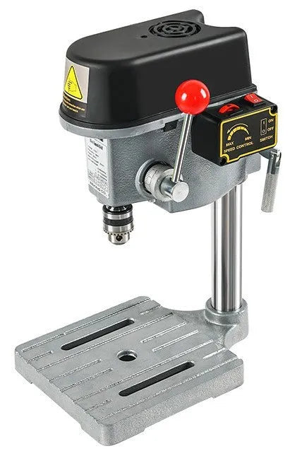 Mini bench drill and milling machine with heavy duty bench pliers on a workbench.