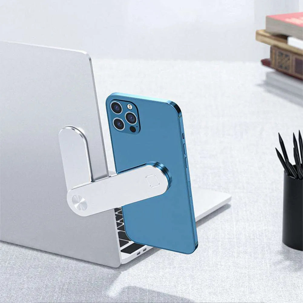 Black aluminium magnetic phone holder mounted on side of laptop screen.