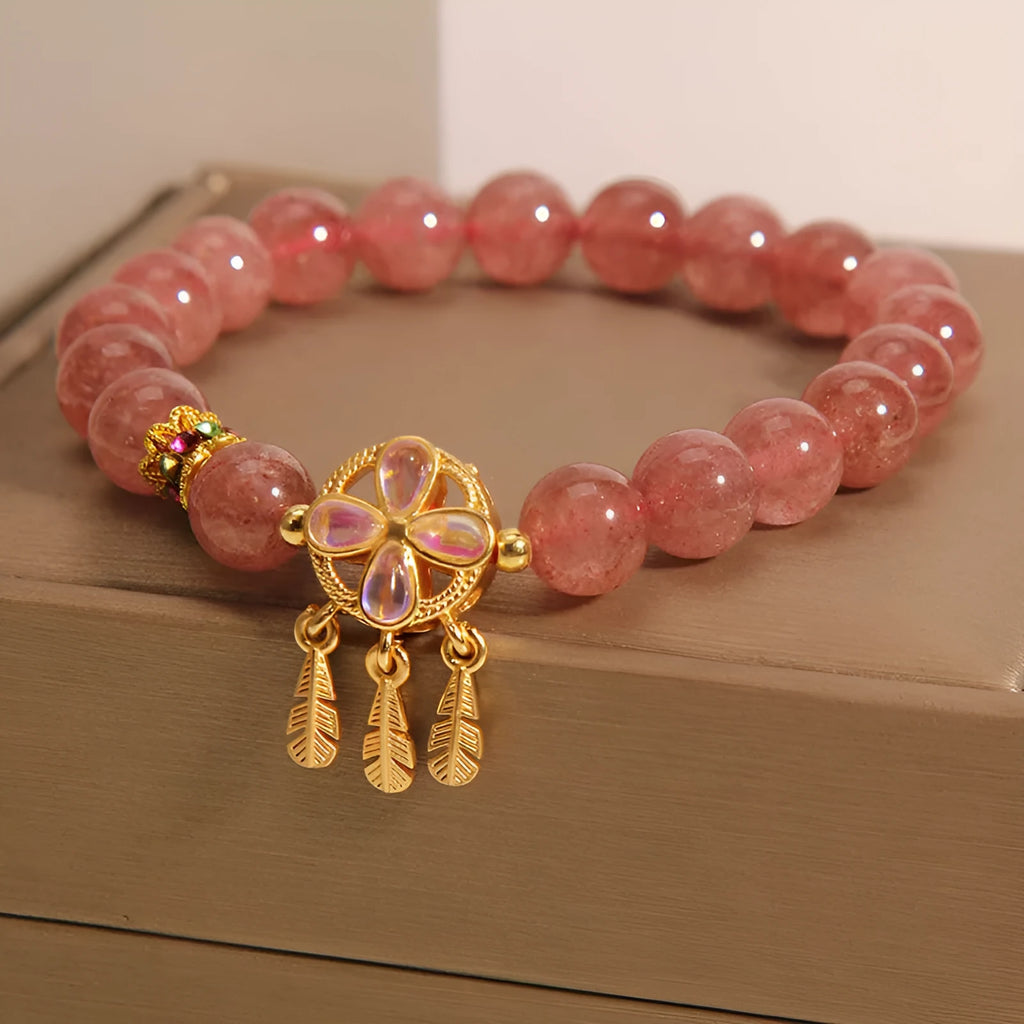 Women's strawberry quartz bracelet with dream catcher pendant and four-leaf clover charm in natural pink crystal