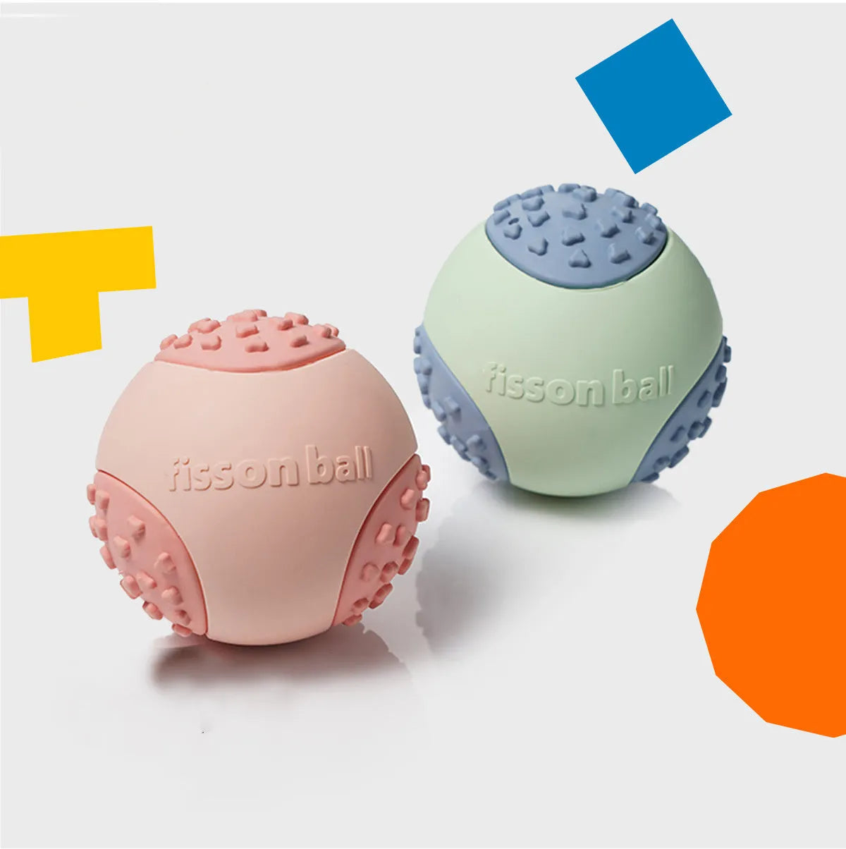 Green and pink durable rolling ball dog toy with a 64mm diameter on a plain background.