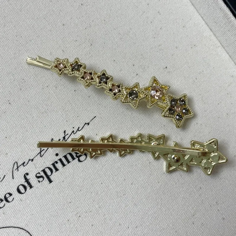 Gold electroplated alloy hair barrette with side clip and five-pointed star charm decoration