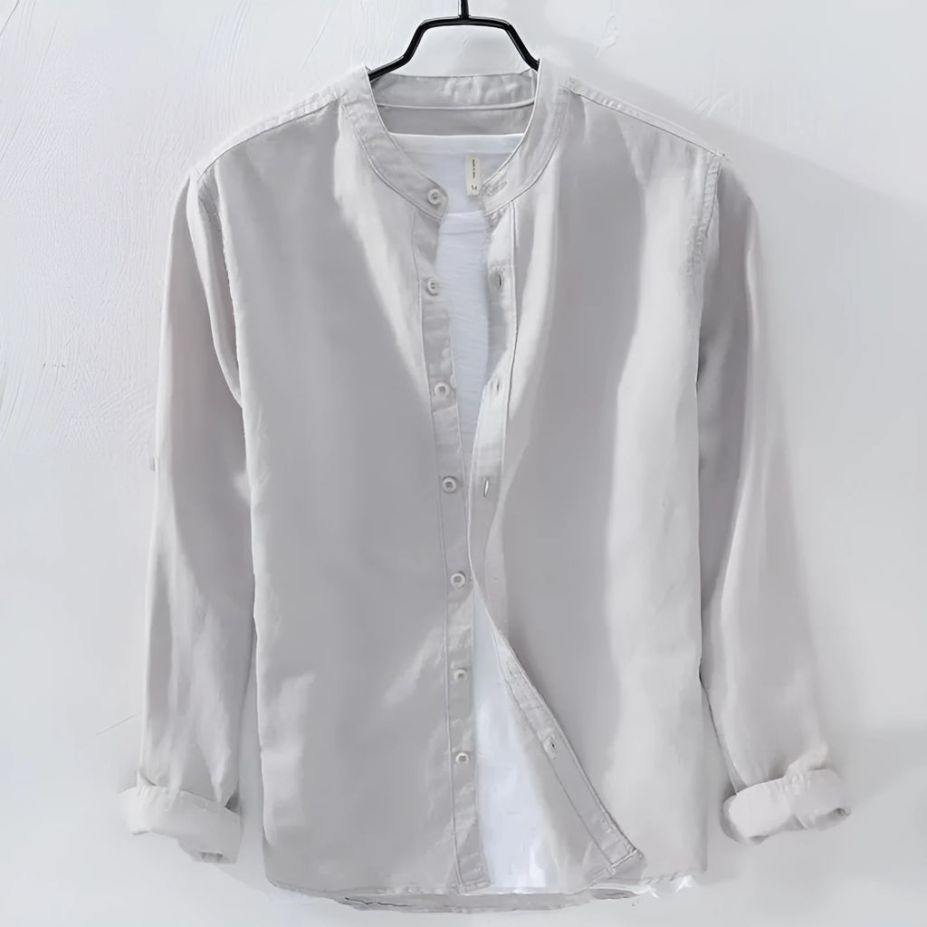 A man's loose-fitting, long-sleeve casual shirt in a cotton linen blend, shown in a solid colour.
