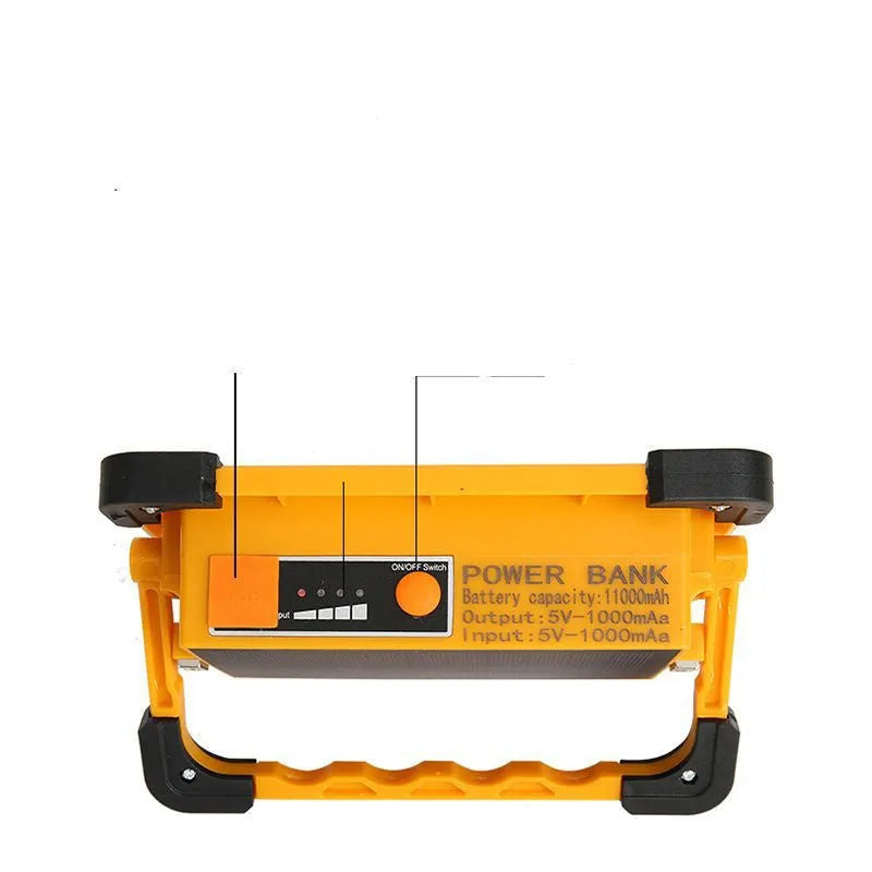 Yellow outdoor portable solar LED light with power bank and magnetic base, 36LED lamp beads model 5730, sitting on a metal surface