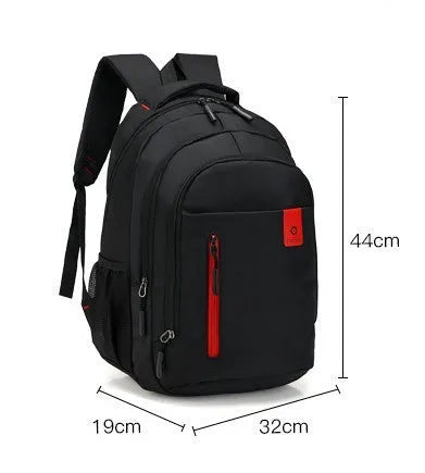Blue Oxford fabric school backpack with padded black shoulder straps and side pockets.