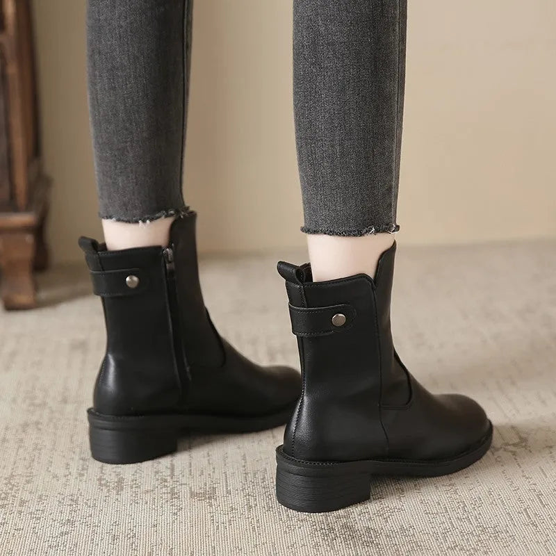 Women's black low heel round toe side zip ankle boots showing front and side views