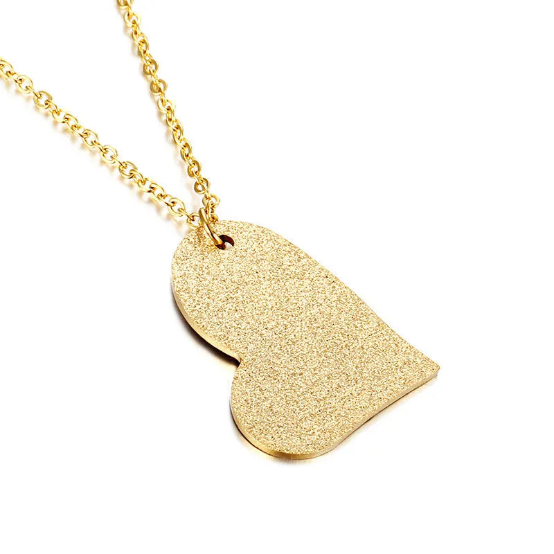A geometric heart-shaped blue titanium steel pendant necklace on a chain.