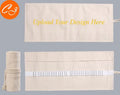 Rolled canvas pencil wrap with elastic bands holding coloured pencils, in 48-slot configuration