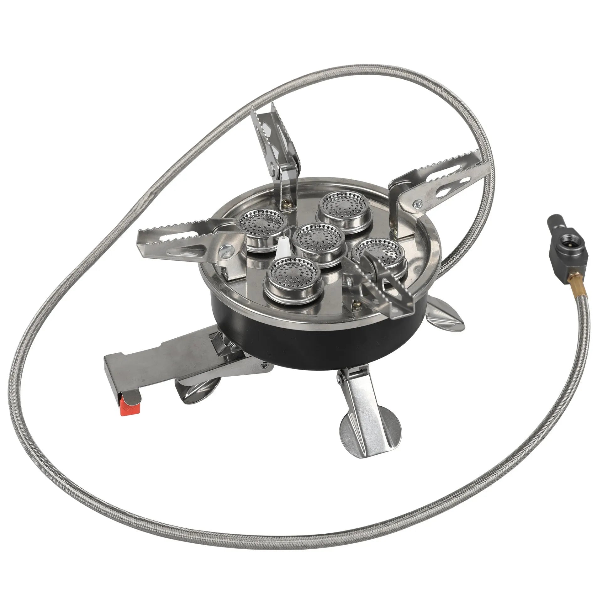 Silver portable folding camping stove with extended copper gas hose, shown on a wooden picnic table.