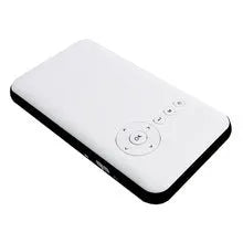 White smart handheld projector with Android system, DLP technology, wireless projection capability, placed on a table